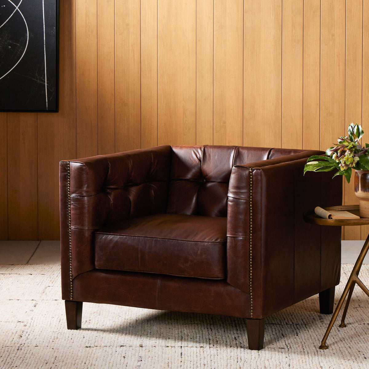 Venice Club Chair in cigar leather with tufted design and wooden legs.