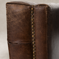 Venice Club Chair in Cigar featuring rich leather texture and decorative nail head trim.