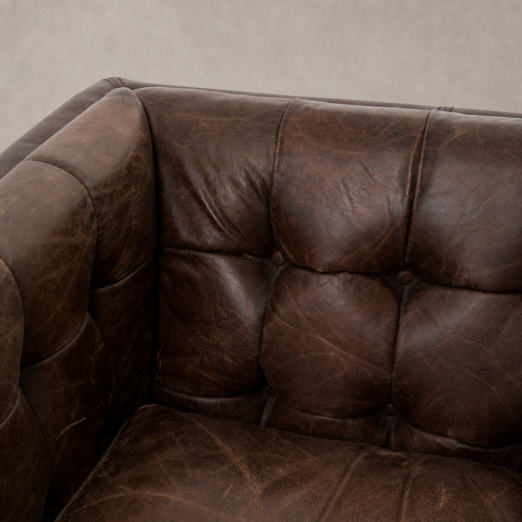 Venice Club Chair in cigar color featuring rich leather texture and tufted design.