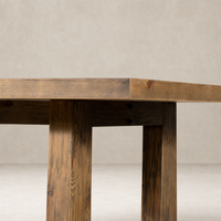 Landsbury Dining Table in waxed pine showcasing rustic wood grain and sturdy legs.