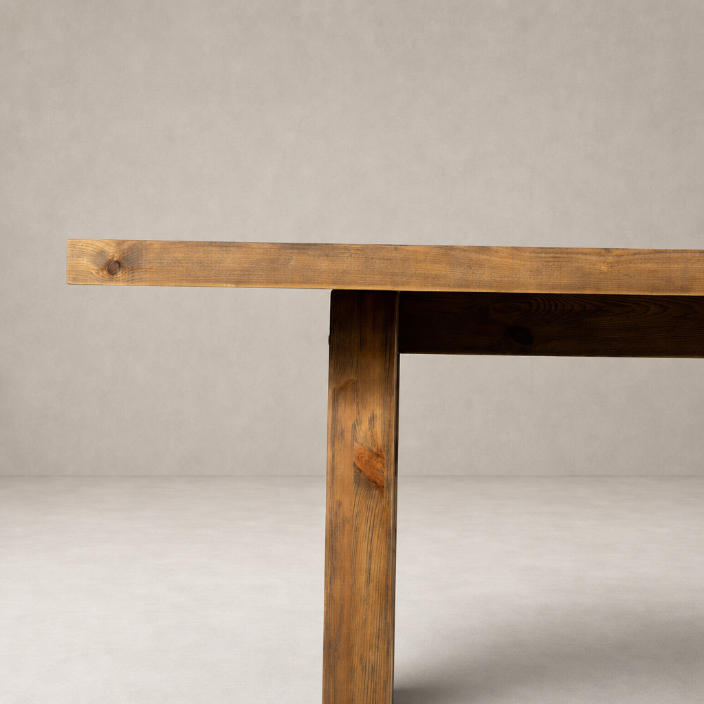 Landsbury Dining Table with a sleek, waxed pine finish and sturdy legs.