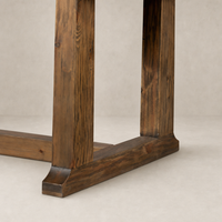 Close-up of the Landsbury Dining Table's waxed pine leg detailing and sturdy base.