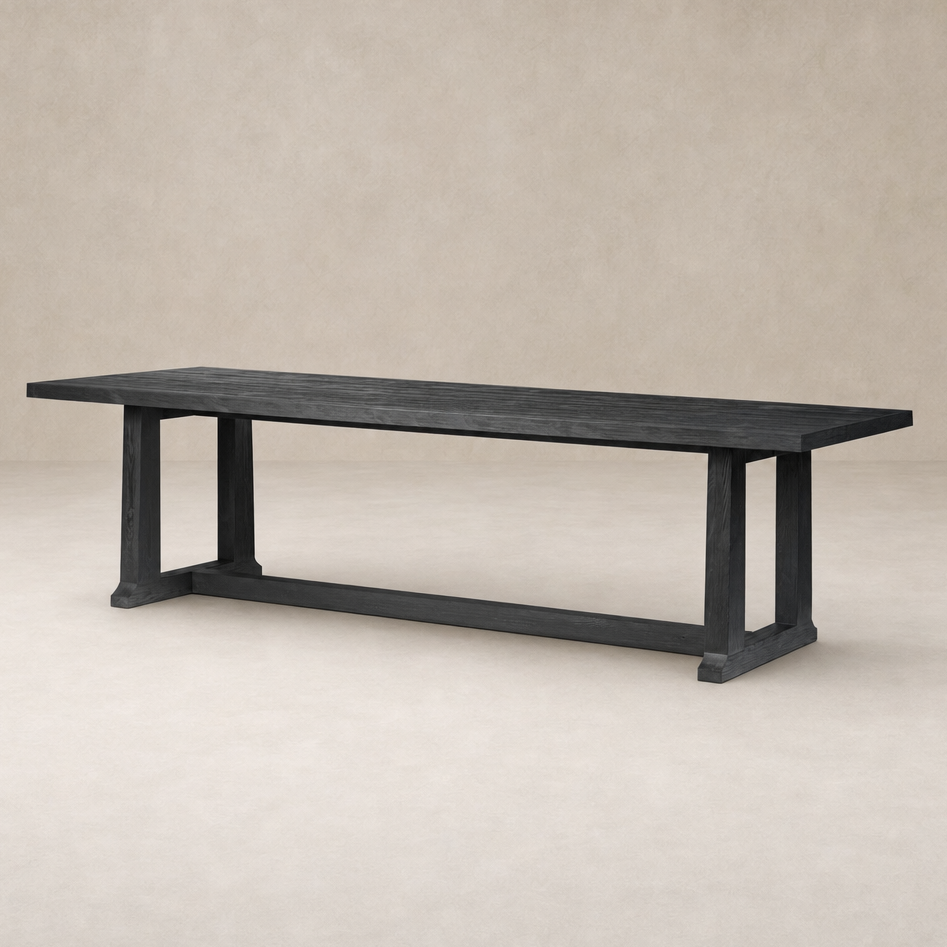 Landsbury Dining Table in black pine with a sleek, modern design and sturdy legs.