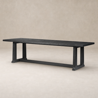 Landsbury Dining Table in black pine with a sleek, modern design and sturdy legs.