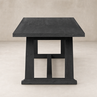 Landsbury Dining Table in black pine with a sturdy square structure and smooth finish.