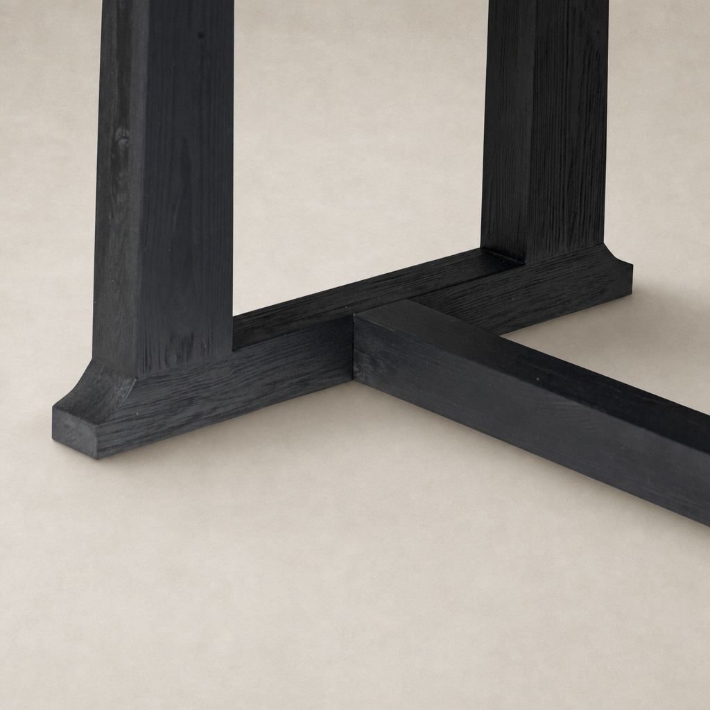 Landsbury Dining Table with a sleek black pine base and detailed corner accents.