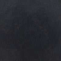 Calder Matchstick Pedestal Table surface showcasing rich dark texture and unique finish.