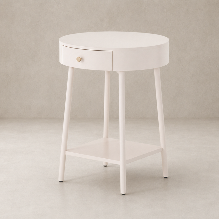 Finn Nightstand in soft white with a round top and gold drawer knob.