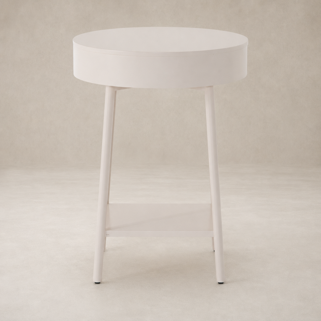 Finn Nightstand features a round top and slender legs in a soft finish.