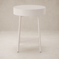 Finn Nightstand features a round top and slender legs in a soft finish.