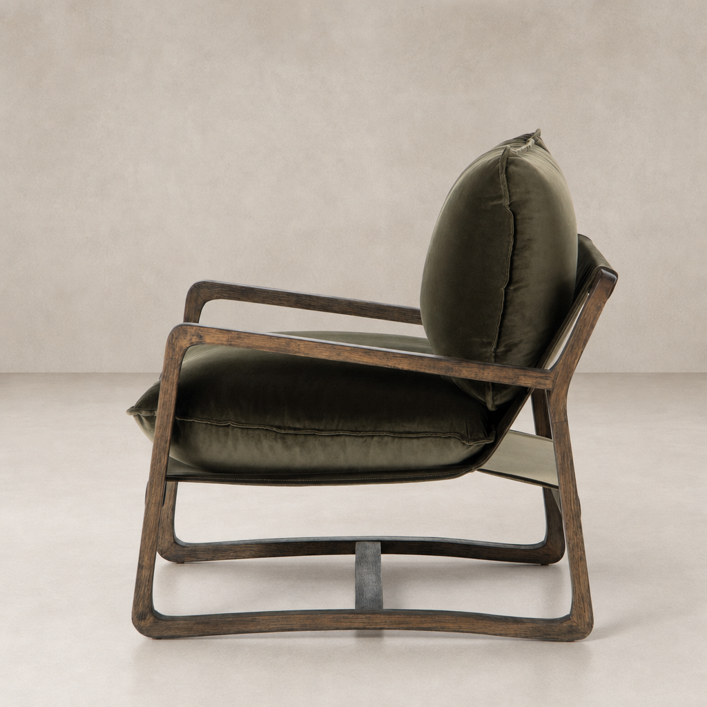Side view of the Sawyer Chair in Surrey Olive, featuring a plush cushion and wooden frame.