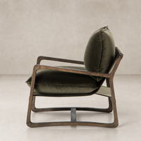 Side view of the Sawyer Chair in Surrey Olive, featuring a plush cushion and wooden frame.