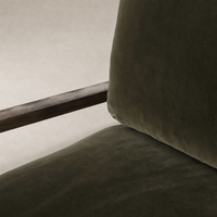Surrey Olive Sawyer Chair featuring soft upholstery and a natural wood armrest.