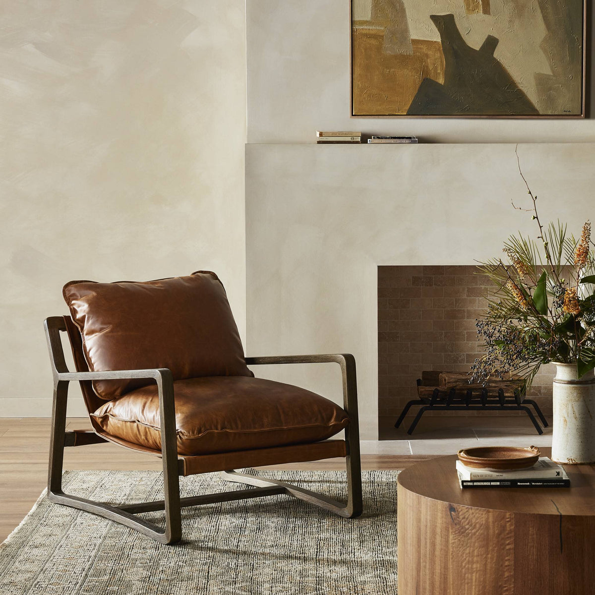 Sawyer Chair in Raleigh Chestnut with plush cushions and sleek metal frame in a cozy living room.
