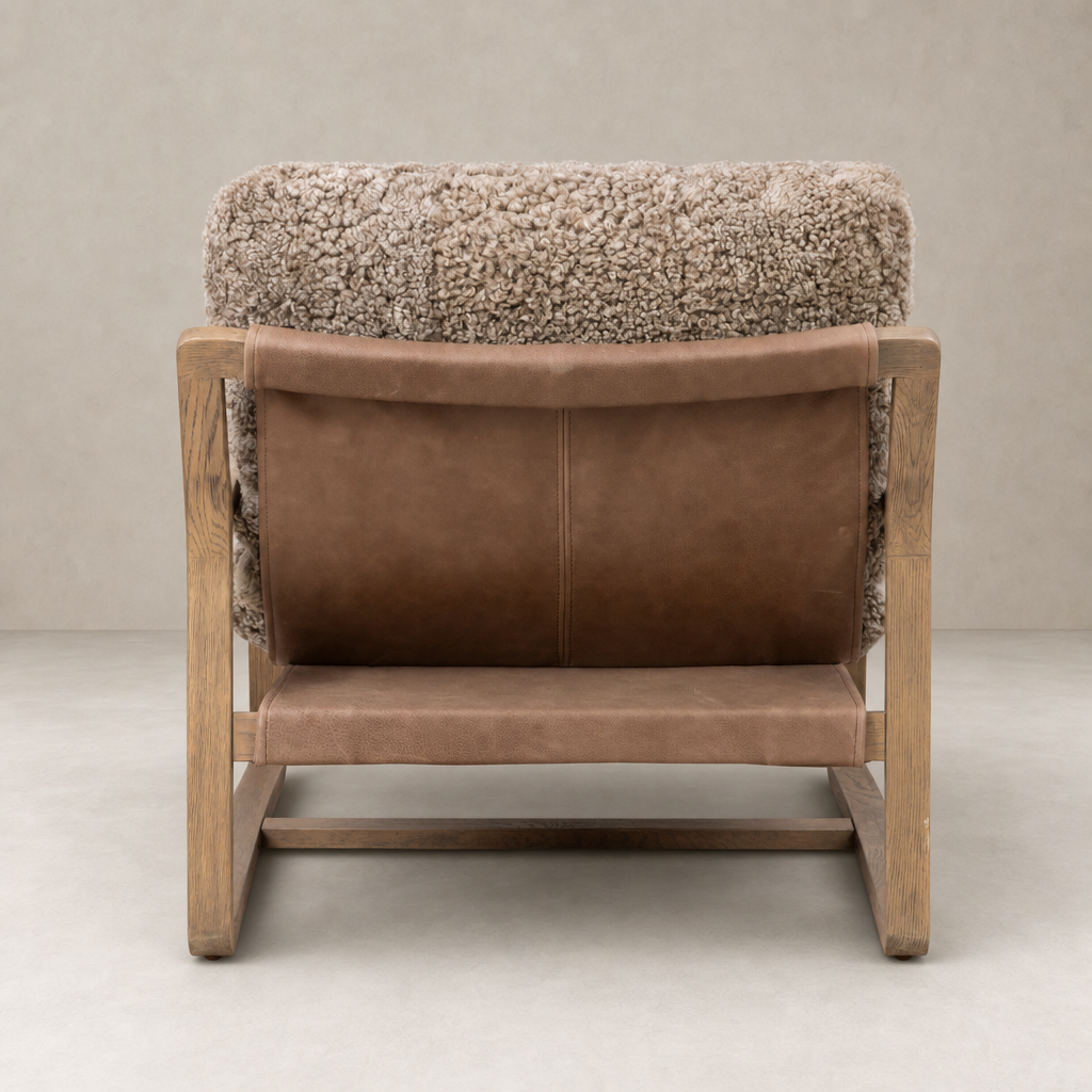 Back view of the Sawyer Chair in taupe shearling with a wooden frame.