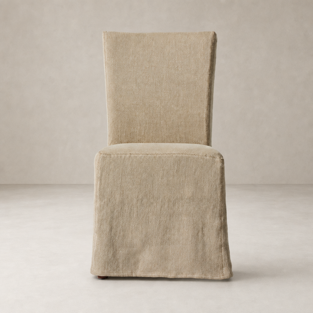 Sierra Slipcovered Dining Chair in Broadway Canvas with textured fabric and elegant shape.