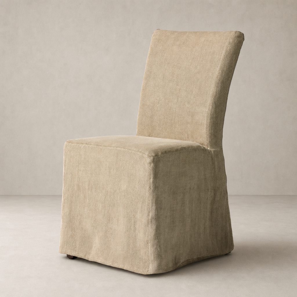 Sierra Slipcovered Dining Chair in Broadway Canvas with soft, textured finish and elegant shape.