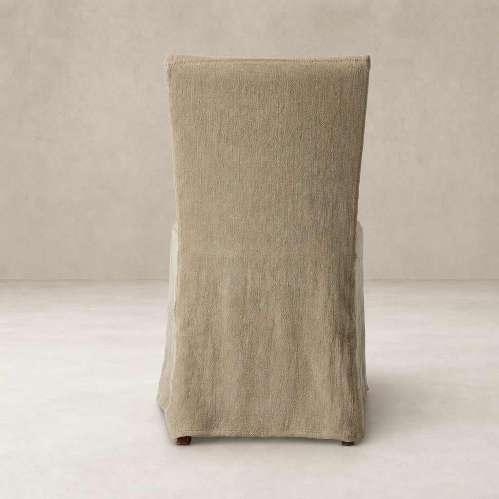Sierra Slipcovered Dining Chair in Broadway Canvas with a textured, soft finish.