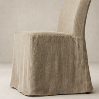 Sierra Slipcovered Dining Chair in Broadway Canvas showcasing soft texture and elegant shape.