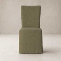 Sierra Slipcovered Dining Chair in Broadway Olive features a sleek, simple design.