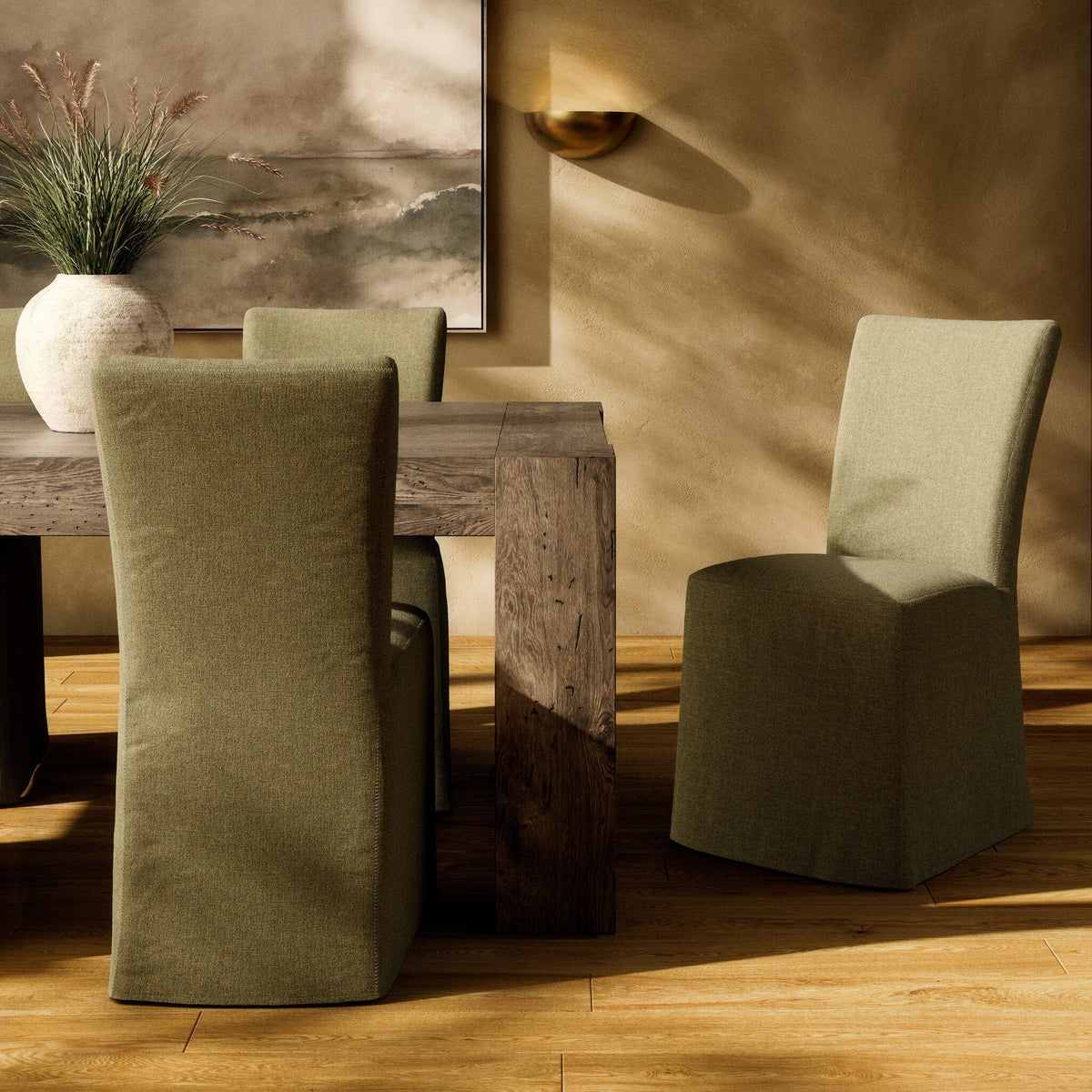 Sierra Slipcovered Dining Chair in Broadway Olive, featuring a sleek, modern design.