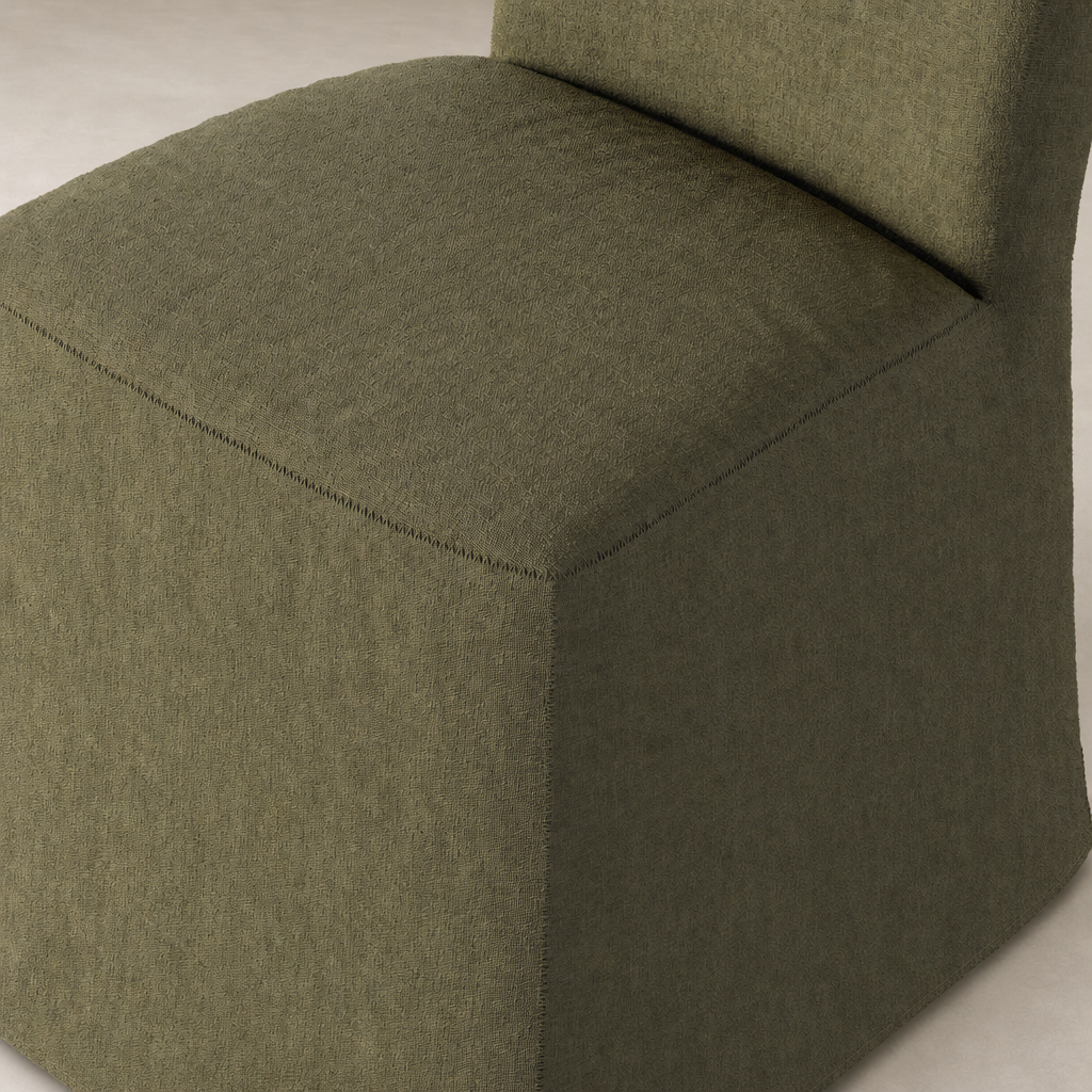 Sierra Slipcovered Dining Chair in Broadway Olive, featuring a modern square shape and textured fabric.