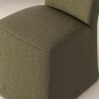 Sierra Slipcovered Dining Chair in Broadway Olive, featuring a modern square shape and textured fabric.
