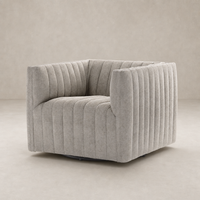 Auden Swivel Chair in Orly Natural featuring a unique ribbed design and soft fabric.