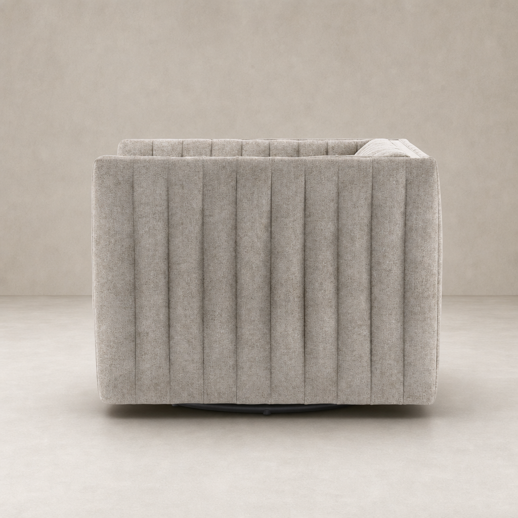 Auden Swivel Chair in Orly Natural with plush, ribbed upholstery and sleek, round base.