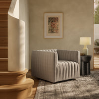 Auden Swivel Chair in Orly Natural with a plush, ribbed fabric design.