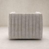 Auden Swivel Chair in Orly Natural with textured vertical stripes and sleek design.