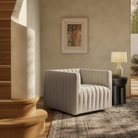 Auden Swivel Chair in Dover Crescent, featuring a modern quilted design and cozy atmosphere.