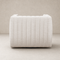 Auden Swivel Chair in Dover Crescent featuring a sleek, curved design and textured fabric.