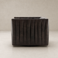 Auden Swivel Chair in Deacon Wolf with plush tufted back and modern design.
