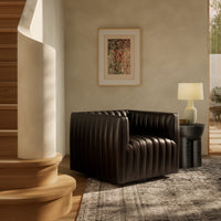 Auden Swivel Chair in Deacon Wolf with a modern ribbed design and cozy setting.