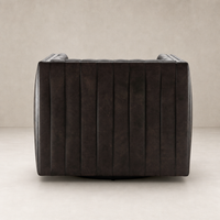 Auden Swivel Chair in Deacon Wolf featuring a sleek, textured, barrel-shaped design.