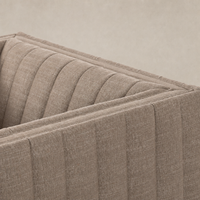 Auden Swivel Chair in Crypton Nomad Taupe showcasing its textured, ribbed fabric detail.