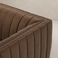 Auden Swivel Chair in Maestro Cigar with textured, quilted upholstery detail.