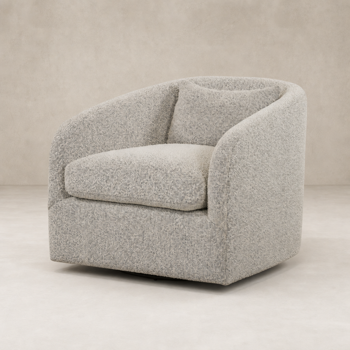 Magnolia Swivel Chair in Knoll Domino features a rounded design and plush cushions.