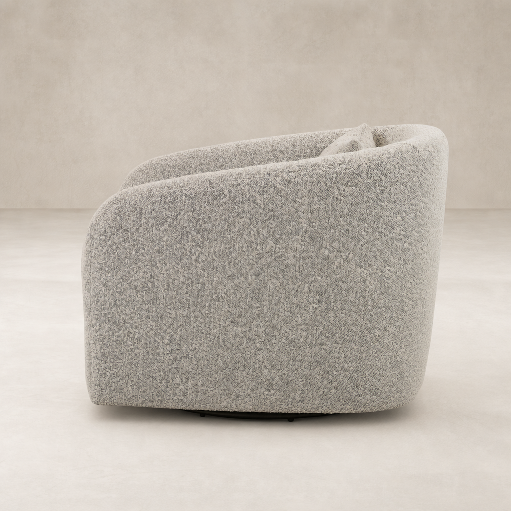 Magnolia Swivel Chair in Knoll Domino fabric, featuring a soft, rounded design.