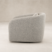 Magnolia Swivel Chair in Knoll Domino fabric, featuring a soft, rounded design.