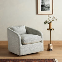 Magnolia Swivel Chair in Knoll Domino features curved design and plush cushioning.