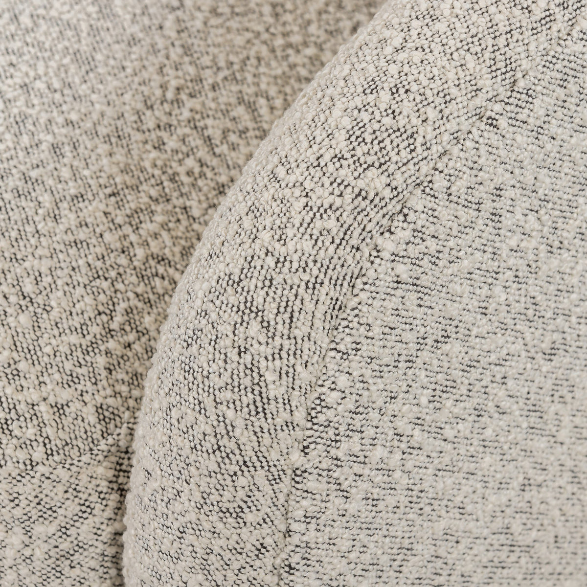 Close-up of the Magnolia Swivel Chair in Knoll Domino fabric, showcasing soft texture and unique pattern.