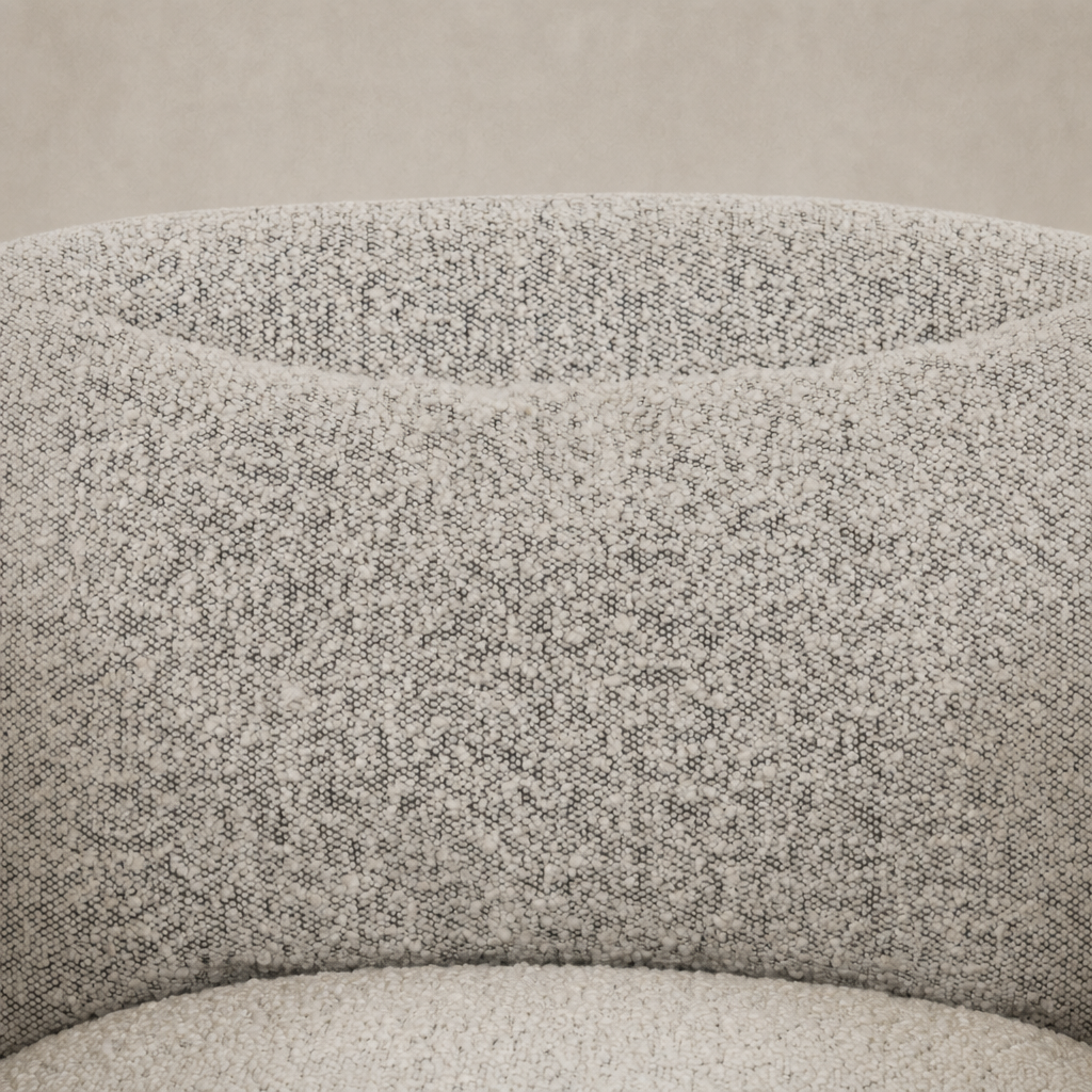 Magnolia Swivel Chair in Knoll Domino fabric featuring a textured, soft surface.