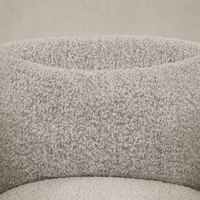 Magnolia Swivel Chair in Knoll Domino fabric featuring a textured, soft surface.
