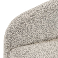 Close-up of Magnolia Swivel Chair in Knoll Domino fabric, showcasing textured beige material.