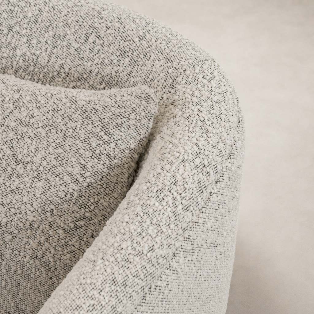 Magnolia Swivel Chair in Knoll Domino featuring textured, soft fabric upholstery.