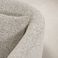 Magnolia Swivel Chair in Knoll Domino featuring textured, soft fabric upholstery.