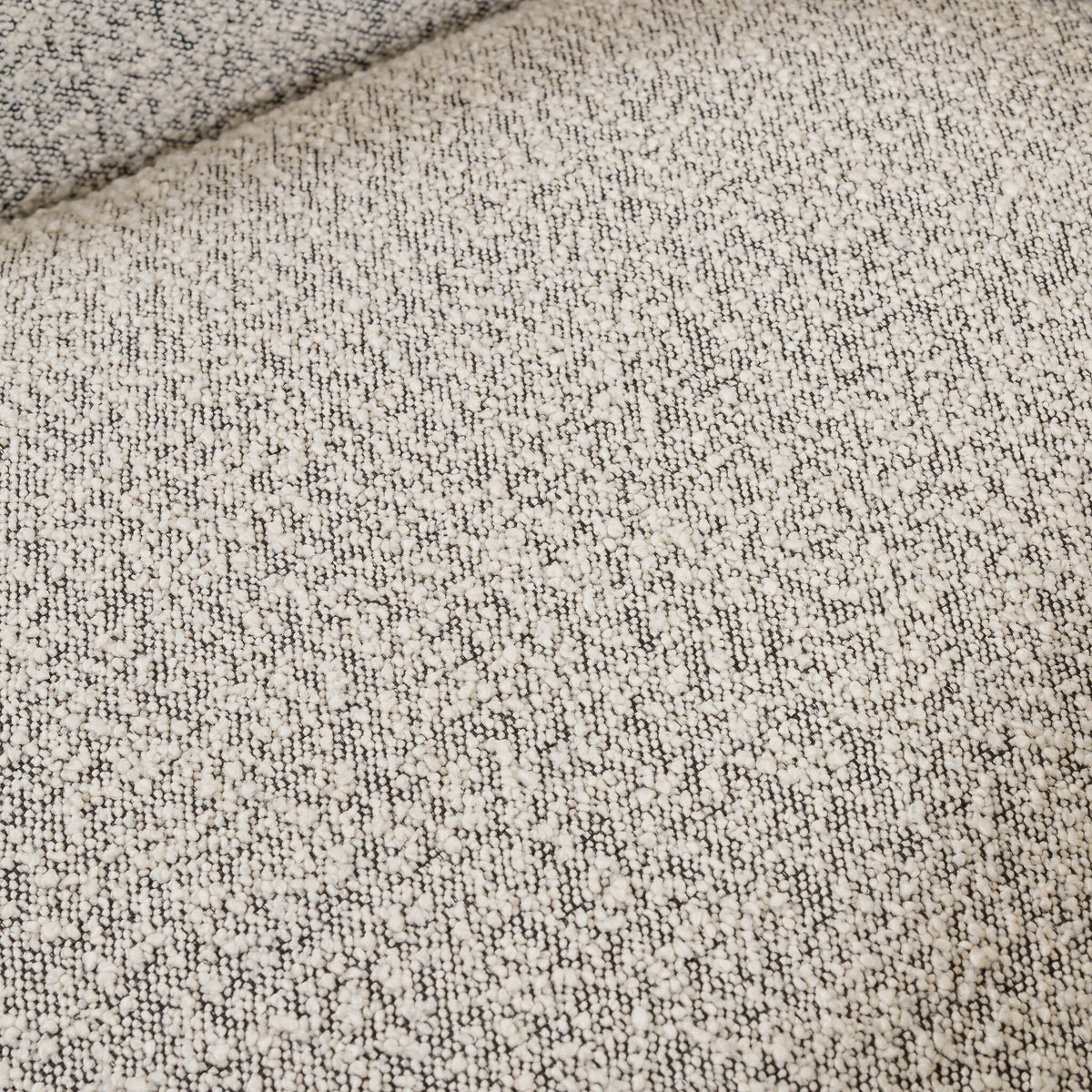Textured Knoll Domino fabric of the Magnolia Swivel Chair in neutral tones.