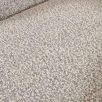 Textured Knoll Domino fabric of the Magnolia Swivel Chair in neutral tones.
